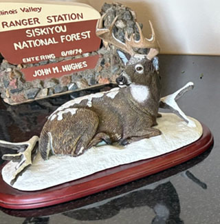 Buck lying in snow by Danbury Mint-630x640px